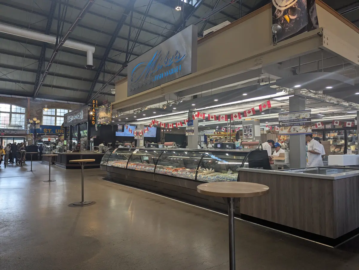 Fish counters and market stalls under the steel roof of St. Lawrence Market