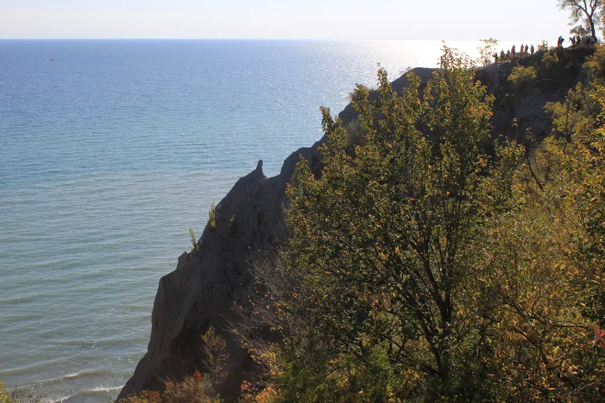 Autumn trees on the Scarborough Bluffs above the blue water of Lake Ontario
