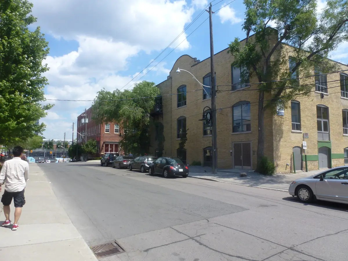 A quiet stretch of Atlantic Avenue lined with brick loft buildings in Liberty Village