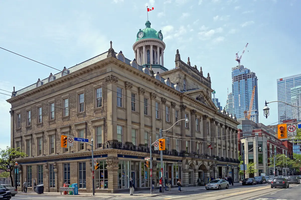 The stone St. Lawrence Hall on King Street, with a green domed cupola and clock on top