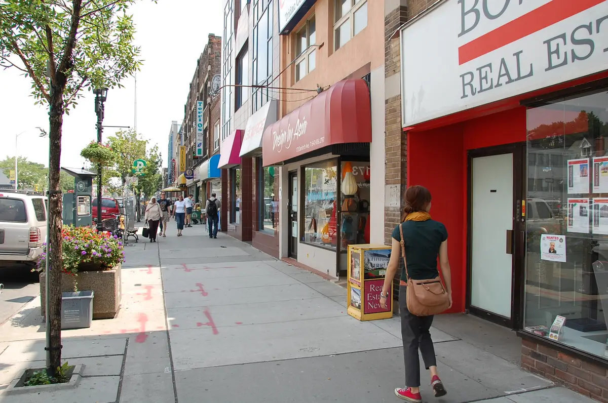 Shopfronts and pedestrians on Danforth Avenue